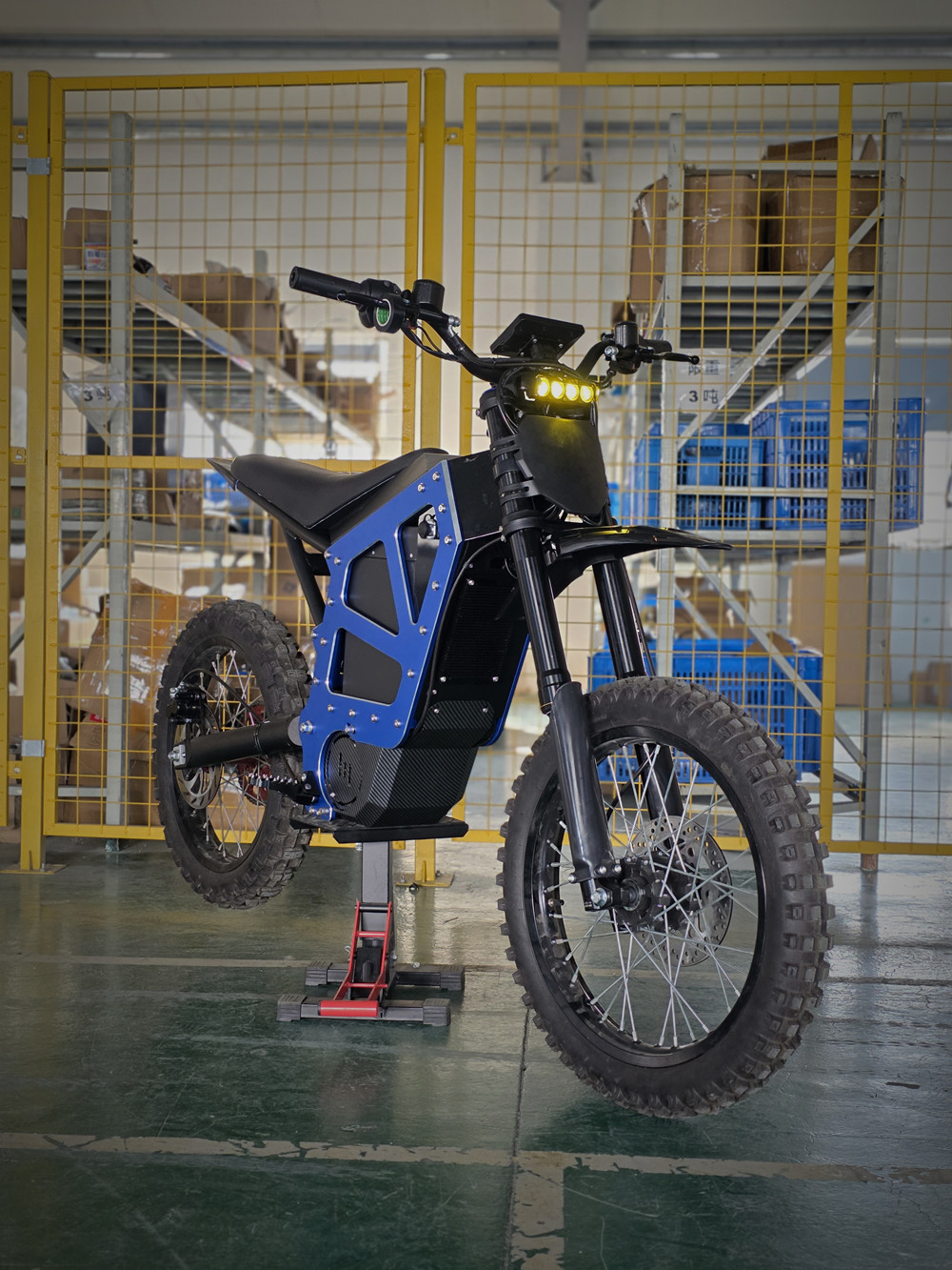 Black MD-6X mid-drive electric dirt bike featuring a massive 72V 58Ah battery, side profile view