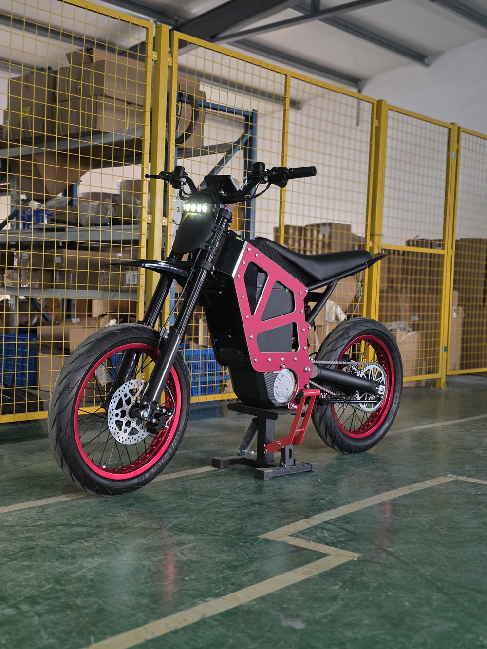 Black MD-6X mid-drive electric dirt bike featuring a massive 72V 58Ah battery, side profile view